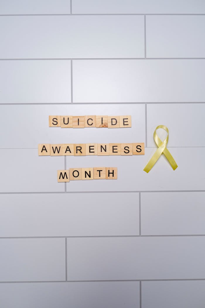 Yellow ribbon symbolizing Suicide Awareness Month for mental health awareness.